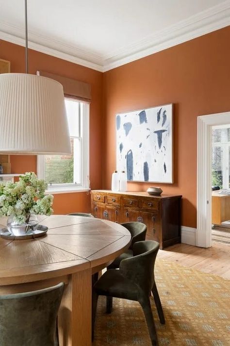 Orange Accent Wall Dining Room, Rust Colored Dining Room, Accent Wall Dining Room Paint Ideas, Burnt Orange Paint Colors, Burnt Orange Dining Room, Terracotta Dining Room, Dining Room Orange, Orange Dining Room, Orange Accent Walls