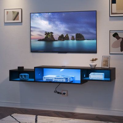 The floating TV shelf with LED lights provides cool and elegant blue lighting. With cool lighting, this wall mounted TV stand will bring better entertainment experience for your family to watch movies and play games. This space-saving floating entertainment center is perfect for living rooms and bedrooms. This wall mounted TV stand with power outlet and 79" supply cord is very convenient, which is perfect for your TV, DVD, WiFi router, mobile phone , tablet computer, etc. Recessed power strips a Floating Shelf Under Tv, Wall Mount Entertainment Center, Floating Tv Shelf, Wall Mount Tv Stand, Floating Entertainment Center, Under Tv, Led Tv Stand, Floating Tv Stand, Floating Tv