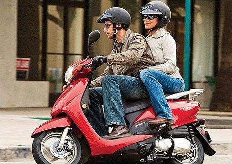 2 people on scooter | Read the full article at motorcycle-usa.com 2 People Motorcycle, 2 People On A Motorcycle, 2 People Riding Motorcycle, People Riding Motorcycles, Two People On Motorcycle, Riding Motorcycle Reference, Riding Scooter, Figure Sketches, Motorcycle Backpacks