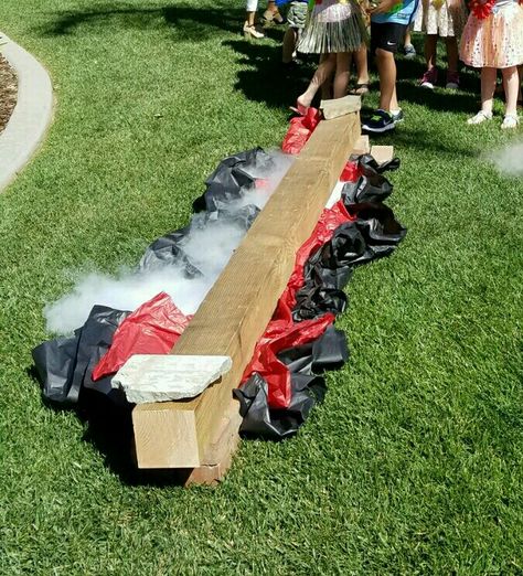 Moana birthday party theme decor or game: lava pit crossing. Wood on bricks, crumpled paper and dry ice. Great for luau game too! Lava Party, Floor Is Lava Trunk Or Treat, Floor Is Lava Birthday Party, Kids Luau Parties, Luau Games, Moana Birthday Party Theme, Moana Themed Party, The Floor Is Lava, Luau Birthday Party