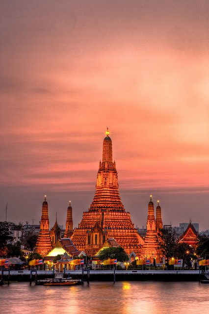 Wat Arun at Sunset, Bangkok, Thailand.   Go to www.YourTravelVideos.com or just click on photo for home videos and much more on sites like this. Jigsaw Pictures, Traveling Asia, Bangkok Travel Guide, Thailand Wallpaper, Wat Arun, Bangkok Travel, Phuket Thailand, Ho Chi Minh City, Mongolia