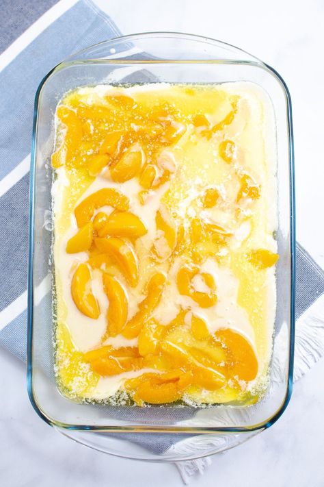 Peach Cobbler With Canned Peaches is an easy peach cobbler recipe that uses 5 ingredients. A quick dessert that is made from scratch and uses self rising flour, milk, butter and more. Don't wait and try this canned peaches cobbler today. A great throw together dessert for unexpected guests, potlucks, tailgating, and more. Peach Cobbler With Canned Peaches And Self Rising Flour, Easy Peach Cobbler Recipe 3 Ingredients, 3 Cup Cobbler, 4 Ingredient Peach Cobbler, Canned Peach Cobbler Recipe Cake Mixes, Peach Cobbler With Self Rising Flour, Juicy Peach Cobbler, Peach Cobbler Using Can Peaches, Dessert Using Canned Peaches