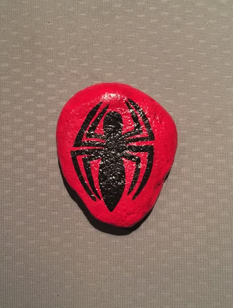 Spider-Man logo Painted Rock Spider Man Painted Rocks, Spider Man Rock Painting, Rock Painting Ideas Characters, Shell Paintings, Rock Drawing, Spiderman Painting, Spider Man Logo, Diy Rock Art, Painted Rock Animals