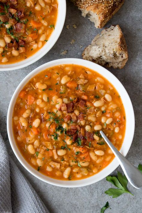 Made with white beans and crispy bacon, this bean and bacon soup recipe is easy to make and a hearty and high-protein meal. White Bean And Bacon Soup, Bean And Bacon Soup Recipe, Bariatric Soups, Bean Bacon Soup, Kay Nutrition, Bacon Soup Recipes, Bean And Bacon Soup, Soup With Bacon, Homemade Beans