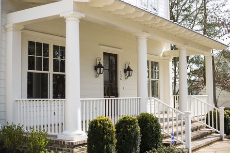 Colonial Farmhouse • RKA Construction  Exposed rafter tails  (no gutters?) Exposed Rafter Tails, Classical Home, Oxford Mississippi, Garage Door Types, Exposed Rafters, Colonial Farmhouse, Glass Garage Door, Pergola Lighting, Neoclassical Architecture