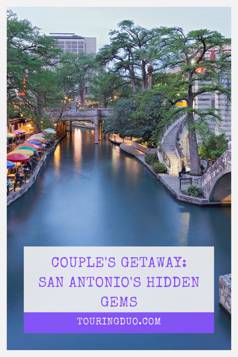 A vibrant evening scene at San Antonio Riverwalk with a serene river, colorful umbrellas lining the walkway and lush green trees framing historic architecture. Overlay text promotes 'Couple's Getaway: San Antonio's Hidden Gems' at TouringDuo.com. San Antonio Couples Trip, Romantic Restaurant San Antonio, San Antonio Things To Do Couples, San Antonio Texas Things To Do, Things For Couples, San Antonio Things To Do, San Antonio Vacation, San Antonio Hotels, Texas Vacation