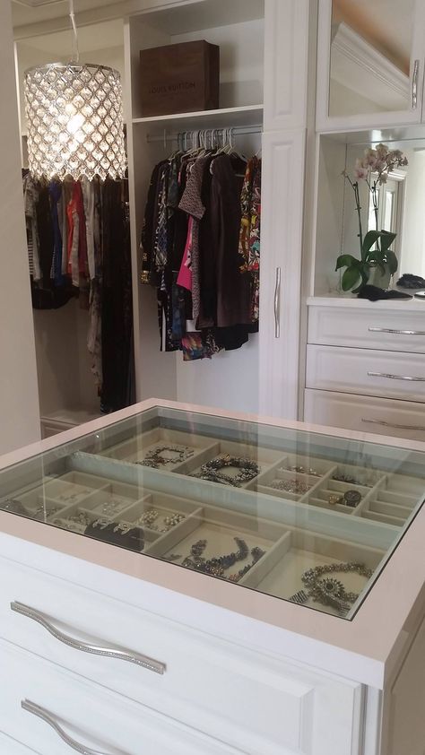 A see through center island counter top, allowing you to view your precious jewelry at a glance.    Designed by Senior Designer Jeanne Hessen  Learn more: https://www.closetfactory.com/custom-closets/ Closet Island Jewelry Drawers, Closet Island Glass Top, Center Closet Island, Closet Island With Jewelry Storage, Walk In Closet Center Island, Glass Top Jewelry Drawer, Closet Island With Glass Top, Jewelry Island In Closet, Closet Center Island