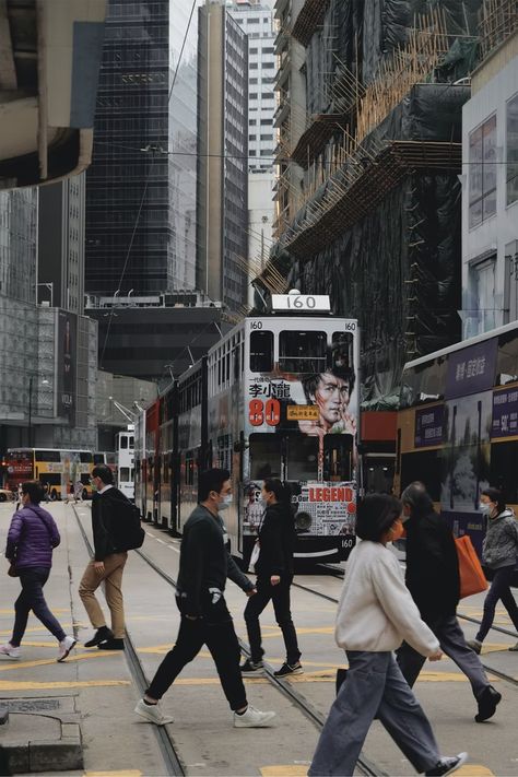 people walking on street near red tram during daytime photo – Free Sheung wan Image on Unsplash