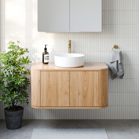 Made in Melbourne - Made to order 5-6 weeks Size: ** L x 500D x 450H Wall hung timber vanity Available in 900mm, 1200mm, 1600mm, 2000mm Features 30mm solid timber top with curved timber veneer sides and fronts. The curved sides are a voided space Each vanity is finished in a hard wax oil made from a blend of natural oils and waxes. All cabinets feature premium Blum Legrabox with soft closing drawer runners and Blum soft close hinges where applicable. Location of the basin bowl is customisable to Curved Bathroom Vanity, Beautiful Bathroom Cabinets, Timber Bathroom Vanities, Timber Vanity, Cabin Bathroom, Custom Bathroom Vanity, Cabin Bathrooms, Timber Veneer, Custom Bathroom