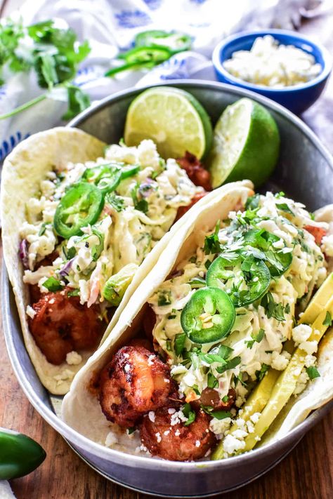 If you love tacos, these Blackened Shrimp Tacos are a must! Made with homemade blackened seasoning and cilantro lime coleslaw, they're the perfect combination of creamy, spicy, and delicious! Cilantro Lime Coleslaw, Homemade Blackened Seasoning, Blackened Shrimp Tacos, Lime Coleslaw, Shrimp Burrito, Lemon Tree Dwelling, Cilantro Lime Slaw, Blackened Shrimp, Cilantro Lime Sauce