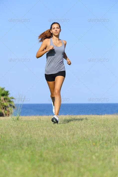 Front view of a beautiful woman running on the grass by AntonioGuillem. Front view of a beautiful woman running on the grass with the sky and the sea in the background Sports Photos, The Grass, Front View, Beautiful Woman, Running Women, Good People, The Sky, The Sea, Stock Photos