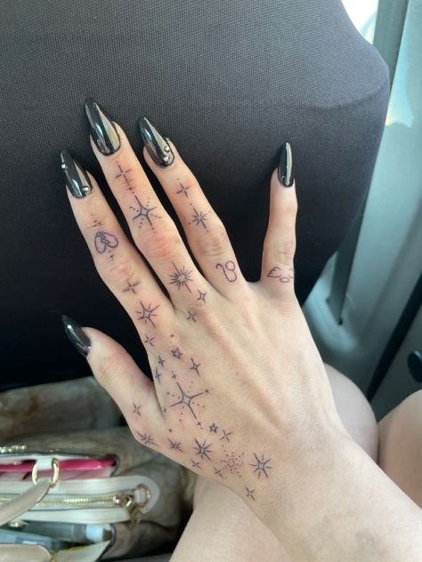 Hand Tattoos Astrology, Astrology Finger Tattoos For Women, Astrological Hand Tattoo, Sparkle Finger Tattoos For Women, Dainty Hand Tattoos Fingers, Mystical Hand Tattoo, Grunge Neck Tattoo, Space Hand Tattoo, Rosary Hand Tattoos For Women