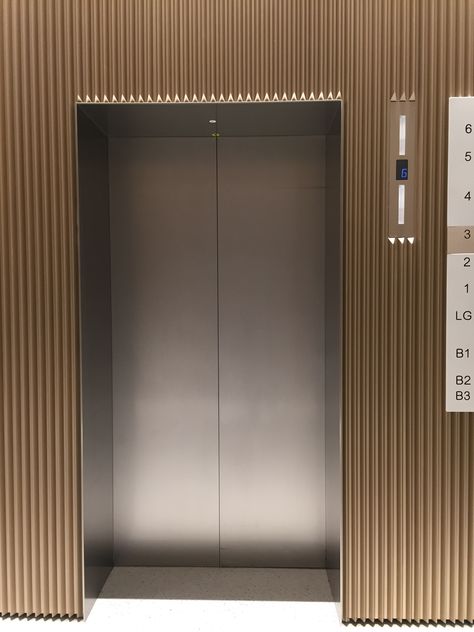 Shenzhen the Mixc Vertical Wood Cladding, Elevator Lobby Design, Lift Lobby, Elevator Interior, Elevator Lobby, Cladding Design, Elevator Design, Elevator Door, Lift Design