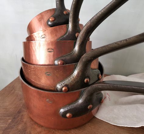 1920s-1930s DEHILLERIN PARIS France set of 5 Copper Pans / 3 mm 353 oz 10 kg / Hammered Copper / Robust Copper Bubble Rivets / Cast Iron Handles / Tin Lining Need to say more than 'Dehillerin Paris' ?! Fabulous complete set of 5 copper pans all stamped DEHILLERIN PARIS. Either has never been used, or has been renovated because the inside still shows marks of the coppersmith's rag who spread the interior lining. Solid and thick copper, the cast iron handles are very robust and fixed by large copp Dehillerin Paris, Boho Cabinet, Copper Cooking Utensils, Copper Molds, Copper Measuring Cups, Cast Iron Handles, Copper Pans, Copper Cookware, Copper Bowl