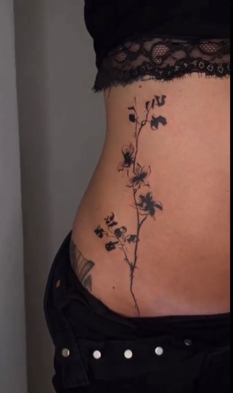 Flowers Lower Back Tattoo, Beautiful Flower Tattoos Black And White, Side Stomach Flower Tattoo, Floral Torso Tattoo, Shoulder Back Flower Tattoo, Hip Tattoos Women Flower, Orchid Arm Tattoo, Whispy Tattoos, Tattoo Stomach Woman