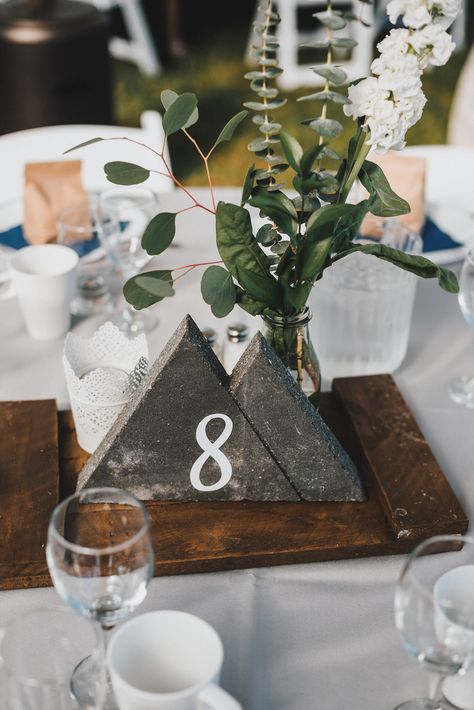 Adventure Table Decorations, Diy Mountain Wedding Decor, Modern Mountain Wedding Decor, Mountain Wedding Decorations Table, Mountain Centerpieces Wedding, Concrete Table Numbers, Mountain Wedding Centerpieces, Mountain Centerpieces, Concrete Wedding Decor