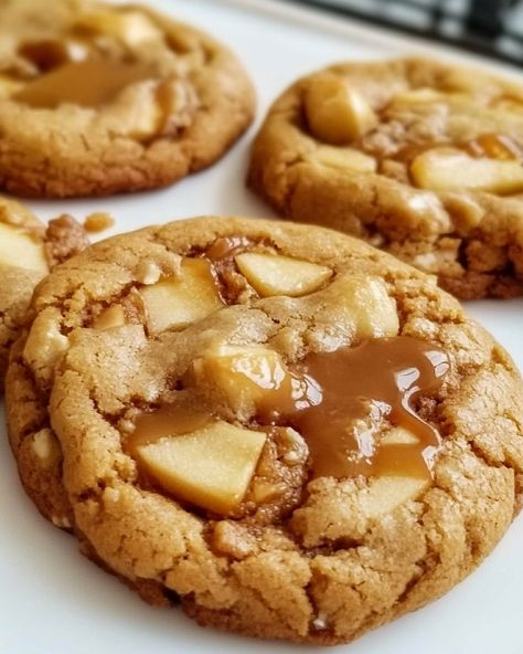 Caramel Apple Cookies Ingredients: - 1 cup unsalted butter, softened - 1 cup granulated sugar - 1/2 cup light brown sugar, packed - 2 large eggs - 1 teaspoon vanilla extract - 2 1/2 cups all-purpose flour - 1 teaspoon baking soda - 1/2 teaspoon baking powder - 1/2 teaspoon salt - 1 teaspoon ground cinnamon - 1/2 teaspoon ground nutmeg - 1 1/2 cups peeled and finely diced apples (like Granny Smith or Honeycrisp) - 1/2 cup caramel bits or chopped soft caramel candies Instructions... Caramel Candies, Caramel Apple Cookies, Caramel Bits, Apple Cookies, Diced Apples, Soft Caramel, Caramel Candy, Ground Nutmeg, Caramel Apple