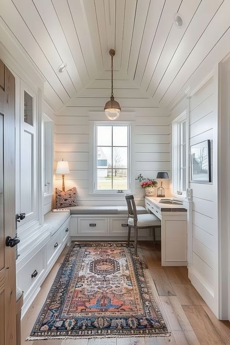 A cozy cottage-style home office with built-in seating, a charming desk, and a colorful area rug, creating a warm and inviting workspace. Breezeway Office Ideas, Home Office Addition Ideas, Narrow Office Ideas, Farmhouse Office Space, Cottage Home Office, Cozy Cottage Home, Home Office With Built Ins, Beautiful Houses Exterior, Neutral Bedroom Design