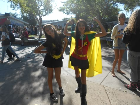 Super Hero Day My best friend and I dressed up as batman and Robin. My Robin outfit was homemade. These are some item's I used to help me create my Robin outfit: -Plain red tank top/ Green shirt/ black skirt( Savers) -Yellow cape ( made out of a laundry bag) -Yellow Ribbon/Felt material ( Joe Ann's) This cost me a total of $12 dollars Robin And Batman Costumes, Batman And Robin Halloween Costumes, Hero's Vs Villains Spirit Week, Superhero Football Theme Outfit, Batman And Robin Costume For Women, Superhero Duo Costumes, Super Hero Spirit Day Outfit, Superhero Spirit Day Outfit, Robin Costume Women