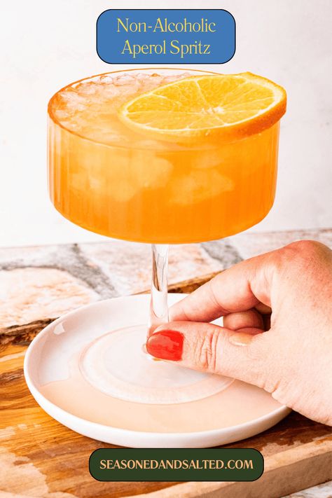 Non-Alcoholic Aperol Spritz Recipe (Italian Mocktail) Spritz Mocktail, Aperol Drinks, Drinks Mocktail, Homemade Drinks Recipes, Eat To Live Recipes, Aperol Spritz Recipe, Popular Cocktail Recipes, Virgin Cocktails, Mocktail Drinks