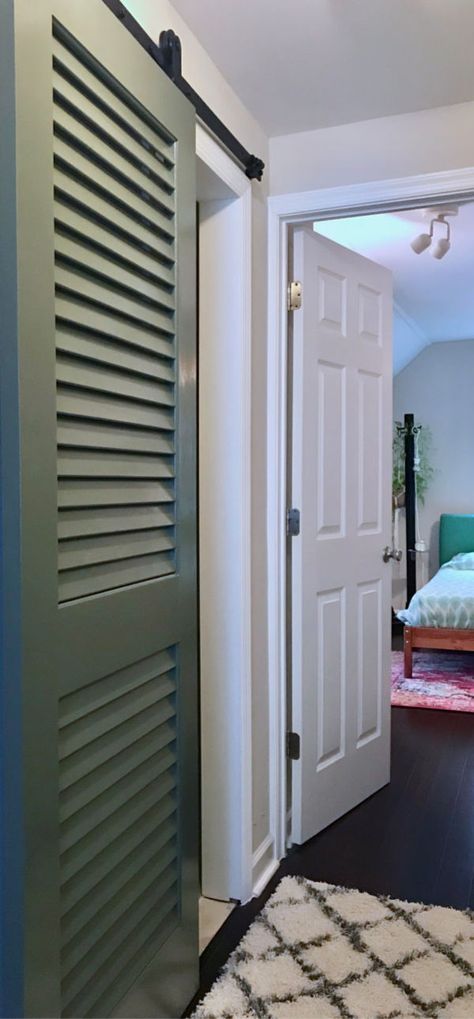 Turn any door, like this louvered door, into a space-saving sliding barn door. Louvered Bathroom Door, Air Conditioning Closet Door Ideas, Louvre Doors Ideas, Sliding Louvered Doors, Diy Louvered Doors, Black Louvered Doors, Louver Doors Ideas, Louvered Door Makeover, Louvered Door Ideas