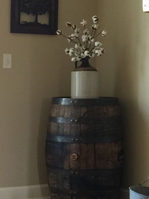 Jack Daniels whiskey barrel, old jug and cotton stems. Becca, my good friend, helped me with this idea. Love it. Whiskey Barrel Home Decor, Old Jugs Decor, Old Barrel Ideas Decor, Whiskey Barrel Decorating Ideas, Whiskey Jug Decor Ideas, Barrel Decor Ideas, Wood Barrel Ideas, Barrels Decor Ideas, Whiskey Barrel Decor