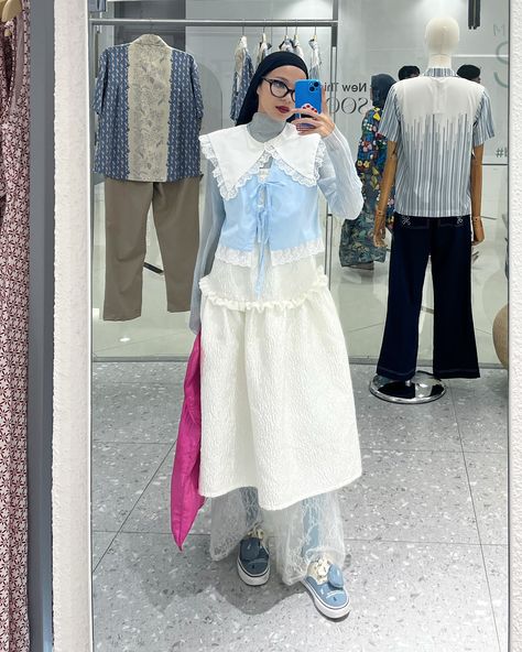 the coquette’s mood still lingers on me from last sunday 🎀🩰👀 what a cute event @sukariamarket 🙌🏼🤍🎪 outfit deetz: inner sheer top —— thrifted blue vest —— @pakaistudio white dress —— @masonstudio_ lace pants —— @callie.cotton shoes —— @vans @tagi__tagi . . . . . . . . . coquette world. coquette day. coquette girl Vest Layering Outfits, Vest Layering, Outfits Hijab, Coquette Girl, Blue Vest, Outfit Inspired, Lace Pants, Shoes Vans, Blue Vests