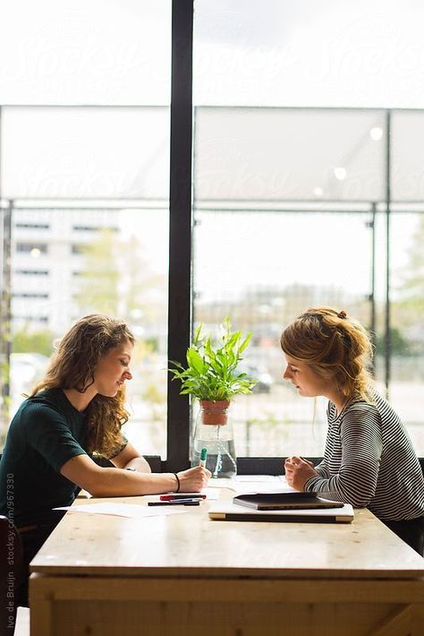 Two young women working, sketching and designing. Using a laptop, sitting at… Team Branding Photoshoot Inspiration, Person On Laptop, 1 On 1 Meeting, Lifestyle Photography Business, Personal Training Marketing, Lifestyle Posing, Client Meeting, Corporate Portraits, Branding Corporate