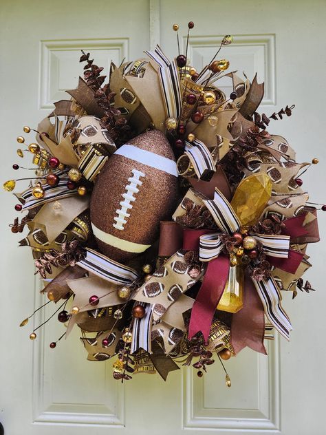 This Football Wreath will look amazing hanging on your door or on your wall! This Grapevine Wreath will be a perfect gift for someone or even a special treat to yourself! Just imagine how many of your guests will be in awe of this Football Wreath. Best places to be used: It is weather resistant outdoors but please move inside in extreme weather conditions. Colors: Brown, White and Burgundy If this one of a kind Football Wreath isn't the perfect fit check out the other related products in my shop Football Themed Wreaths, Diy Football Wreaths For Front Door, Cute Wreaths, Football Wreaths For Front Door, Fall Grapevine Wreath Ideas, Dollar Tree Wreath Ideas, Thanksgiving Wreaths For Front Door, Football Wreath Diy, Sport Wreaths