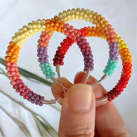 These 11/0 Miyuki seed bead mixes were designed to create sunset and sunrise scenes and patterns. Free patterns are also provided to use with these mixes. Beaded Hoop Earring, Diy Earrings Dangle, Diy Earrings Materials, Sunset And Sunrise, Seed Bead Patterns Free, Hoop Earrings Diy, Seed Bead Crafts, Sunrise And Sunset, Crochet Beaded Bracelets