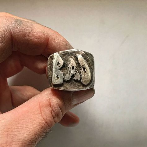 It’s a statement ring bursting with attitude. Made of solid Sterling silver, our BAD ring is large, with a thick band that demands... Cowboy Ring, Strange Rings, Thick Rings, Edgy Rings, Vintage Jewelry Rings, Tooth Ring, Biker Jewelry, Ceramic Ring, Ring Mens