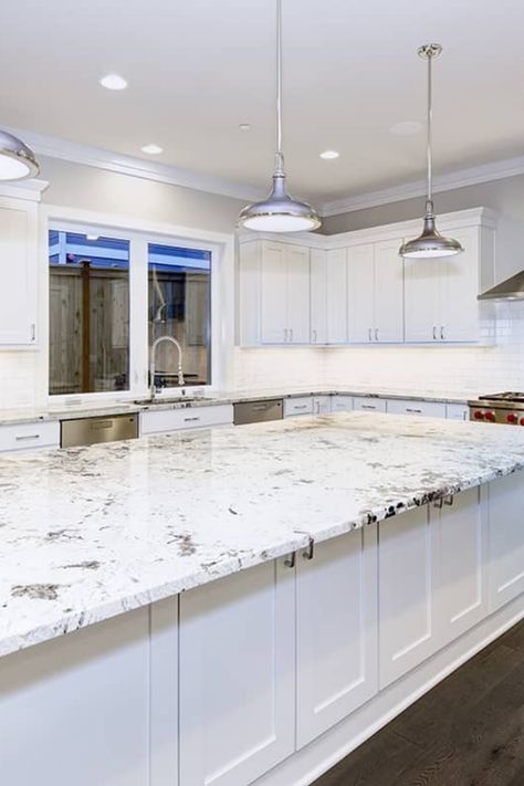 While granite is a highly durable material, you might desire a new color to match a kitchen renovation or update. This article will show you how to change the color of your granite countertops, offering a cost-effective alternative to replacement. Changing Granite Color Countertops, Change Granite Countertop Color, Luna Pearl Granite, Tan Brown Granite, Brown Granite Countertops, White Granite Countertops, Black Granite Countertops, Kitchen Cabinets And Countertops, Brown Granite