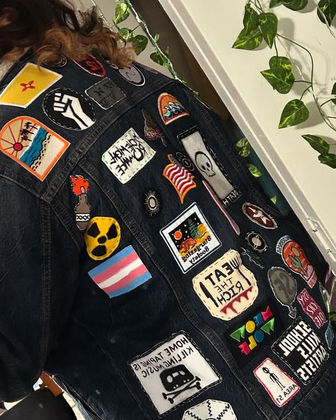 jean jacket back is all full !! can't wait till the entire coat is covered [the two blank spots are reserved for commissioned patches] Black Jacket With Patches, Black Denim Jacket With Patches, Black Jean Jacket With Patches, Decorated Jean Jacket, Jacket Patches Aesthetic, Patches On Jean Jacket, Patchy Jeans, Jean Jacket With Patches, Jean Jacket Patches