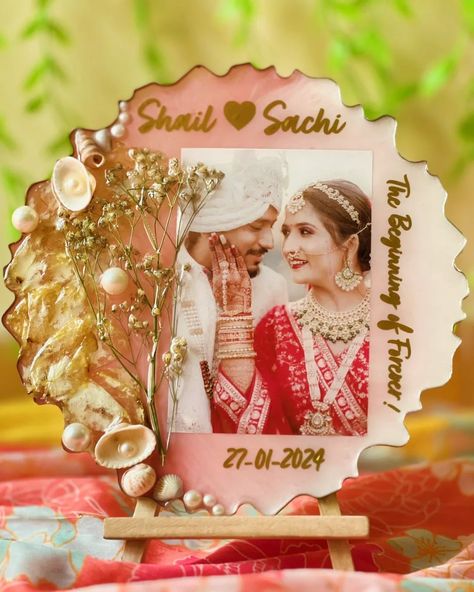 Get yours Wedding Garland preserved by us. This our wedding photo and garland preserved in resin. Dm us to know more details and order this kind of yours. [Wedding Garland Preservation, Resin Photo Frame, Resin Products, Unique Gift Ideas] #covetedartstudio Resin Photo Frame Ideas, Varmala Preservation, Resin Photo Frame, Resin Photo, Tracker Ideas, Invitation Frames, Bullet Journal Mood Tracker Ideas, Flower Preservation, Wedding Garland