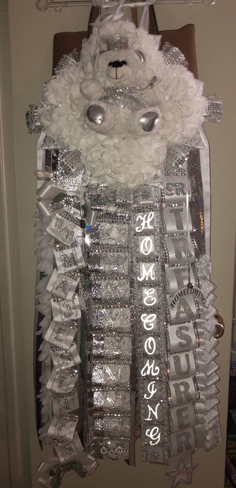 Long senior silver and white homecoming mum Homecoming Mums White And Silver, White And Silver Senior Mum, Silver And White Mums, White Homecoming Mum, Senior Mums Homecoming White And Silver, White Mums Homecoming, Senior Mums Homecoming White, Senior Hoco Mums, Senior Mums