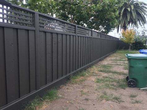 Redwood fence with lattice stained with Benjamin Moore Arborcoat Solid Stain in Dragons Breath 1547  Grey meets brown meets black meets tan meets green... Perfection Benjamin Moore Dragons Breath, Semi Solid Stain, Grey Fence, Fence Paint Colours, Painted Garden Furniture, Cedar Fence Boards, Redwood Fence, Grey Fences, Solid Stain