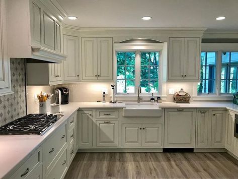 Another happy client. Custom beaded inset cabinetry with raised panel doors paint/highlight finish Silestone Calacatta Gold engineered quartz countertops stainless steel appliances porcelain tile floor etched marble tile behind the cook top #CabinetArtistry #cabinetartistryllc #customkitchen #kitchendesign #kitchen #kitchenremodel #kitchencabinets #whitekitchen #whitecabinets #engineeredquartzcountertops #stainlesssteelappliances Raised Panel Kitchen Cabinets, Panel Kitchen Cabinets, Classic Kitchen Cabinets, Traditional Kitchen Cabinets, Inset Cabinetry, Raised Panel Cabinets, Kitchen Construction, Kitchen Cabinets And Countertops, Engineered Quartz