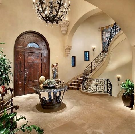 Charming Staircase, Mediterranean Interior Design Style, Staircase Walls, Mediterranean Entryway, Elegant Foyer, Grand Chandelier, Mediterranean Interior Design, Mediterranean Interior, Foyer Chandelier