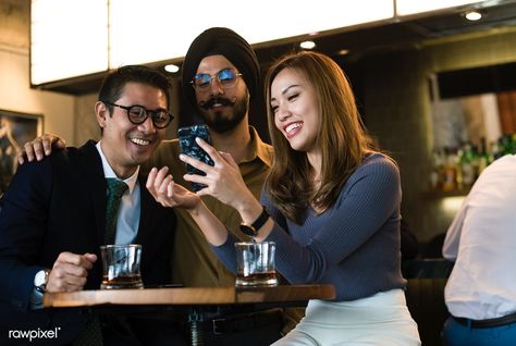 Business people looking at a smartphone together | premium image by rawpixel.com / Jira People Socialising, Best Stocks, Business People, Social Interaction, Happy Hour, Talk Show, Stock Images, Smartphone, Pins