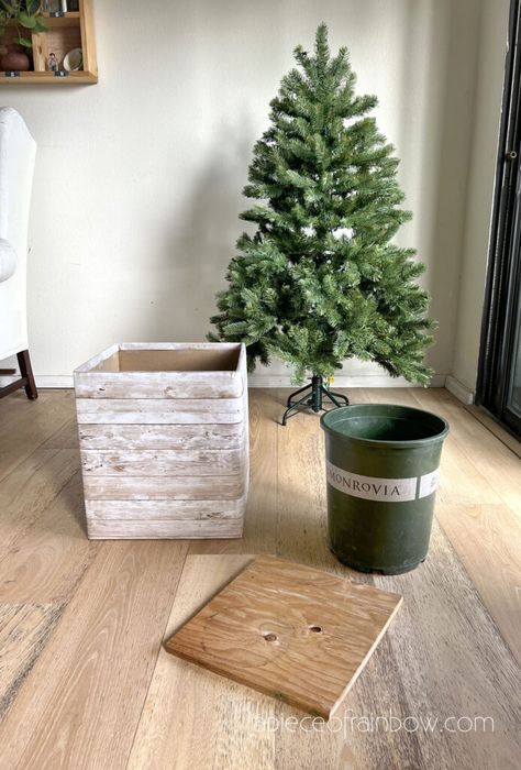 Diy Christmas Tree Base Ideas, Small Tree On Stand, Diy Faux Christmas Tree, Christmas Tree Store Displays, Diy Christmas Tree Village Stand, Create Small Christmas Tree, Christmas Platform Ideas, Elevated Tree Stand, Small Christmas Tree In Planter