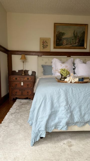 Elizabeth | Home & Decor on Instagram: "Here’s how I refreshed our master bedroom by partnering up with @simpleopulence_home to showcase their amazing textiles! This duvet is their French linen set in dusty blue. I was inspired by the thrifted French print you see hanging above the bed. This dusty blue color of the duvet and shams is so pretty and I can see it working with my decor all year. I love the high end quality of their linen and the relaxed look of it. I also adore the ruffle details, d Seafoam Blue Bedroom, Blue Bedding Aesthetic, Dusty Blue Bedroom, Sky Blue Bedroom, French Blue Bedroom, Dusty Blue Color, Girl Apartment, Bedroom Mood Board, Blue Duvet