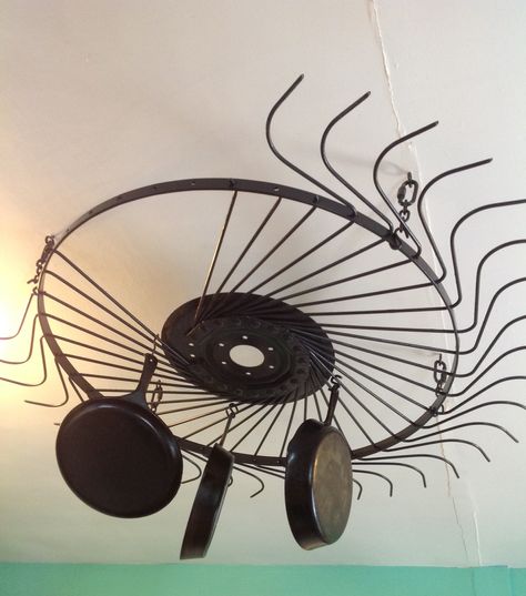 Hay rake wheel pot rack Hay Rake Decor, Hay Rake Wheel Ideas, Rake Decor, Western Farmhouse, Furniture Redos, Housing Ideas, Wheel Decor, Pot Rack, Reno Ideas