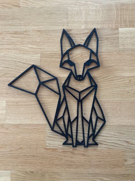 Laser cut geometrical shaped fox. Made out of sustainable wood and painted black. #animals #fox #geometric #geometricart #homedesign #homedecorideas #homedecoration #wood #woodworking #lasercut #laserengraving #switzerland Geometric Fox Drawing, Geometric Art Animal, Geometric Fox, 3d Pen Art, Geometric Wolf, Polygon Art, Diy Leather Earrings, Laser Cut Wood Crafts, Wood Animal