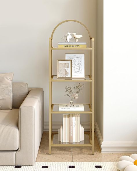 About this item Decorate Your Room: With transparent tempered glass shelves and a gold-colored frame, this 4-tier storage rack allows you to display your greenery, books, and collectibles while elevating the look of your space. The top oval design makes this bookcase unique and stylish,and helps to decorate your room Maximize Enough Space: Sized at 15.7"W x 11.8"D x 47.8"H, this book shelf takes up only little floor space but allows you to make full use of the vertical space for storage. Designed on both sides of the top to prevent items from falling Multifunctional 4-tier Rack: Need a bookcase for your books? Or a display rack for trinkets? Or a storage rack for photos in your bedroom? This 4-tier rack could meet your needs Glass Bookshelves, Steel Shelving Unit, Glass Bookcase, Steel Shelving, Shelving Racks, Globe Decor, Tempered Glass Shelves, Seasonal Home Decor, Display Rack