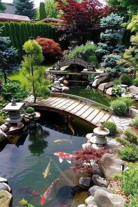 A tranquil Japanese garden featuring a koi pond, traditional wooden bridges, lush greenery, and stone lanterns, creating a serene and peaceful ambiance. Garden Design Water Features, Fence Around Pond Ideas, Outdoor Fish Ponds Ideas, Pond Landscaping Ideas Large, Koi Fish Pond Backyard, Garden With Koi Pond, Cottage Pond, Fairy Garden Pond, Koi Pond Backyard