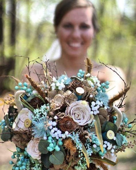 Rustic bridal bouquet adorned with burlap flowers, wooden roses, shot gun shell casings and deer antlers. A beautiful spin for this whimsical enchanted forest Farmhouse Bouquet Ideas, Country Wedding Bouquets Rustic, Western Bouquet Wedding, Hunting Wedding Bouquets, Deer Antler Bouquet, Antler Bouquet Wedding Flowers, Deer Antler Bridal Bouquet, Wedding Bouquets With Deer Antlers, Western Bouquet