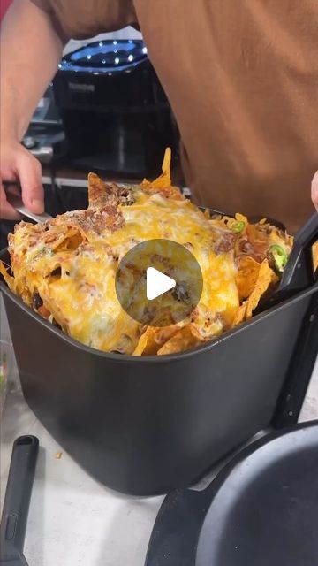 Yumm hannafest on Instagram: "Ready to Dive into 21-Layered Air Fryer Nachos? 🧀🥑🌶️  #nachos #airfryer #recipe #snack #foodie  Indulge in this 21-layered air fryer nachos extravaganza! 🧀🥑🌶️ Are you ready to dive into this delicious snack sensation? Let’s make some nachos magic happen!  Layers below (makes a lot of nachos)  2 bags of Doritos (you chose the flavor) 2 cups salsa verde 1 pound tacos seasoned ground beef 1 cup black beans 4 cups grated Mexican blended cheese 1 cup pickled jalapeños 1/2 cup fresh jalapeños 1 cup diced onions 1/2 cup sour cream 1 cup pico de gallo 1 cup guacamole" Dorito Nachos In A Bag, Oven Nachos Recipes, Airfryer Nachos, Layered Nachos, Air Fryer Nachos, Loaded Nachos Recipe, Nachos Recipe Beef, Airfryer Recipe, Baked Nachos