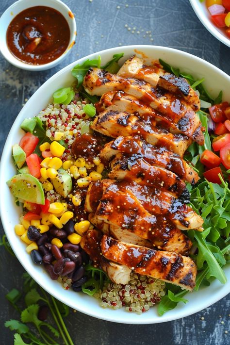 Grilled chicken salad with quinoa, black beans, corn, tomatoes, avocado, and arugula, drizzled with barbecue sauce. Quinoa Salad With Chicken, Bbq Chicken Quinoa, Quinoa Chicken Salad, Fluffy Quinoa, Chicken Quinoa Salad, Clean Eating Detox, Restaurant Lunch, Tangy Bbq Sauce, Quick Healthy Dinner