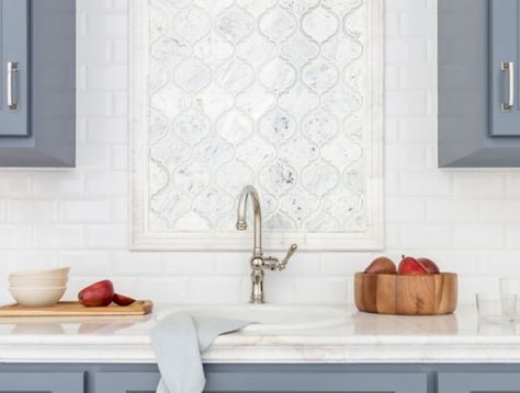 Kitchen with blue cabinets and white marble arabesque backsplash above sink. Backsplash Above Sink, Marble Arabesque Backsplash, Textured Tiles Kitchen, Kitchen Remodel Backsplash, Kitchen With Blue Cabinets, Craftsman Bungalow Interior, Kitchen Sink Wall, Kitchen Backslash, Marble Kitchen Backsplash