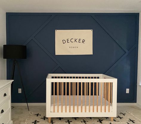 Blue geometrical accent wall for toddler room Easy Accent Wall Ideas Nursery, Nursery Accent Wall Blue, Nursery Navy Accent Wall, Toddler Boy Accent Wall, Wall Moulding Boys Room, Kids Accent Wall Boys, Dark Blue Nursery Boy, Blue Wall Panelling Nursery, Toddler Room Accent Wall